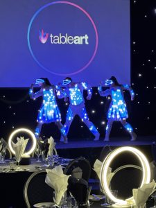 LED dance show Supernova performed in Blackout with Table decorations provided by TableArt synced to the music