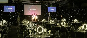 Dancers in blackout LED show synced with TableArt LED table centres